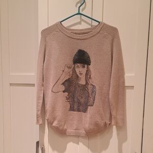 057- Super Cute Beige Sweater with Fashion Graphic And Fur Pom Pom Hat Detail.